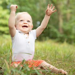 happy baby playing outside