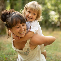 mom and toddler playing outide