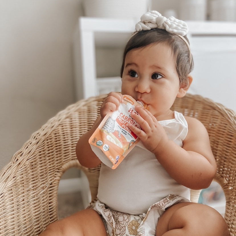 toddler eating carrot cat Holle pouch