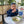 baby eating 4-grain cereal at a table
