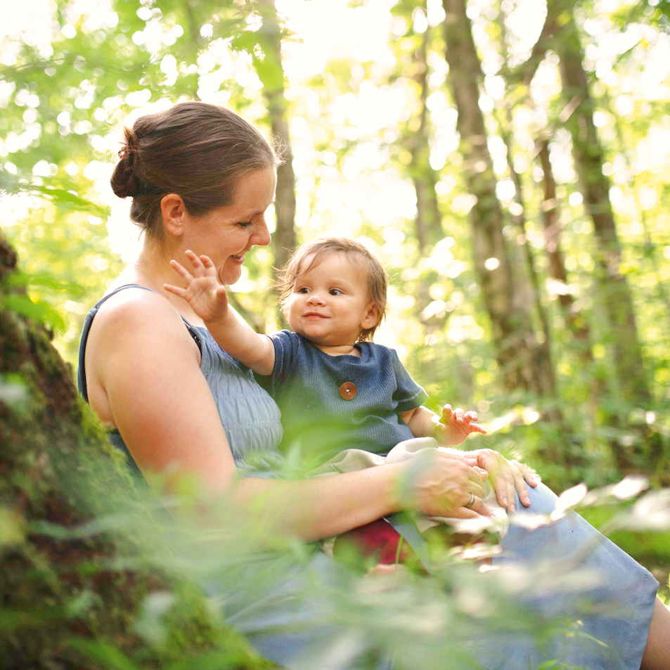 baby with mother in the forest