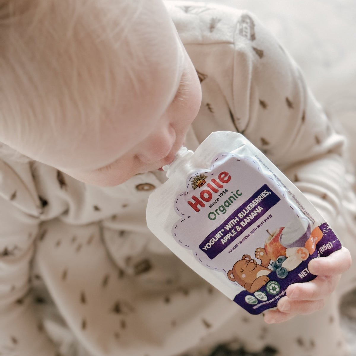 child eating Holle blueberry yogurt